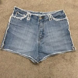 Light wash denim shorts with ripped edge details
